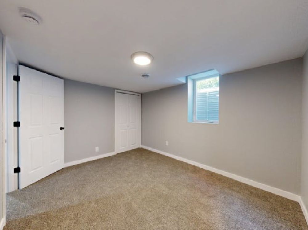A well maintained basement hopper window